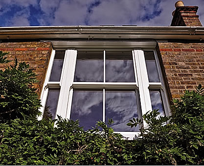 Traditional sliding white sash window